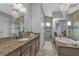 Bathroom with granite countertops, double sinks, and large mirror at 1220 Spanish Cay Ln, Punta Gorda, FL 33950