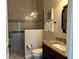 Clean bathroom with shower, toilet and granite countertop at 1220 Spanish Cay Ln, Punta Gorda, FL 33950