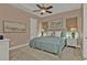 King-size bed, nightstands, and artwork in a tranquil bedroom setting at 1220 Spanish Cay Ln, Punta Gorda, FL 33950