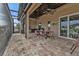 Outdoor kitchen and dining area on covered patio at 1220 Spanish Cay Ln, Punta Gorda, FL 33950
