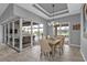 Bright dining room with sliding glass doors leading to the pool at 1220 Spanish Cay Ln, Punta Gorda, FL 33950