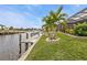 Private dock with seating area and canal views at 1220 Spanish Cay Ln, Punta Gorda, FL 33950