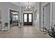 Bright and spacious entryway with tile flooring and double doors at 1220 Spanish Cay Ln, Punta Gorda, FL 33950