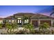 Luxury home with tile roof, two-car garage, and landscaped entry at 1220 Spanish Cay Ln, Punta Gorda, FL 33950