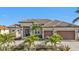 Two-story house with a two-car garage and palm trees at 1220 Spanish Cay Ln, Punta Gorda, FL 33950