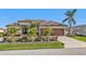Single-Gathering home with two-car garage and tropical landscaping at 1220 Spanish Cay Ln, Punta Gorda, FL 33950