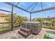 Hot tub with steps and screened enclosure at 1220 Spanish Cay Ln, Punta Gorda, FL 33950