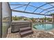 Hot tub next to pool with screened enclosure at 1220 Spanish Cay Ln, Punta Gorda, FL 33950