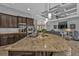 Modern kitchen with granite countertops and dark wood cabinetry at 1220 Spanish Cay Ln, Punta Gorda, FL 33950