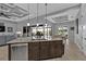 Island kitchen with granite countertops and stainless steel dishwasher at 1220 Spanish Cay Ln, Punta Gorda, FL 33950