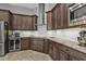 Kitchen features granite countertops and dark wood cabinets at 1220 Spanish Cay Ln, Punta Gorda, FL 33950
