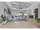 Open living area with high ceilings, tile floors, and access to the backyard at 1220 Spanish Cay Ln, Punta Gorda, FL 33950