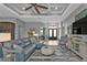 Elegant living room with gray sectional and entryway view at 1220 Spanish Cay Ln, Punta Gorda, FL 33950