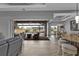 Living room with view of the pool and patio through sliding doors at 1220 Spanish Cay Ln, Punta Gorda, FL 33950