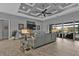 Bright living area with gray sofas, high ceilings, and large windows at 1220 Spanish Cay Ln, Punta Gorda, FL 33950