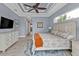 Bright main bedroom with king-size bed and access to the bathroom at 1220 Spanish Cay Ln, Punta Gorda, FL 33950