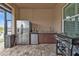 Stainless steel appliances and granite countertops in outdoor kitchen at 1220 Spanish Cay Ln, Punta Gorda, FL 33950