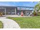 Spacious backyard patio with fire pit and seating at 1220 Spanish Cay Ln, Punta Gorda, FL 33950