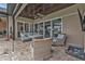 Relaxing covered patio with wicker furniture at 1220 Spanish Cay Ln, Punta Gorda, FL 33950