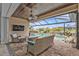 Relaxing covered patio with pool views and comfortable seating at 1220 Spanish Cay Ln, Punta Gorda, FL 33950