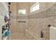 Large walk-in shower with built-in seat and multiple shower heads at 1220 Spanish Cay Ln, Punta Gorda, FL 33950