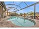 Inviting kidney-shaped pool with a screened enclosure at 1220 Spanish Cay Ln, Punta Gorda, FL 33950