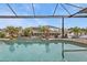 Relaxing pool area with screened enclosure and canal view at 1220 Spanish Cay Ln, Punta Gorda, FL 33950