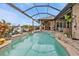 Beautiful kidney shaped pool with a screened enclosure at 1220 Spanish Cay Ln, Punta Gorda, FL 33950