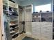 Large walk-in closet with ample shelving and drawers at 1220 Spanish Cay Ln, Punta Gorda, FL 33950