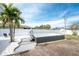 Backyard oasis with a swim spa and sandy area at 1236 Fleetwood Nw Dr, Port Charlotte, FL 33948