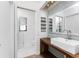 Modern bathroom with wood vanity, subway tile, and walk-in shower at 1236 Fleetwood Nw Dr, Port Charlotte, FL 33948