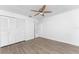 Bright bedroom with ceiling fan and wood-look floors at 1236 Fleetwood Nw Dr, Port Charlotte, FL 33948