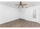 Bright bedroom with ceiling fan, wood-look floors, and spacious closet at 1236 Fleetwood Nw Dr, Port Charlotte, FL 33948