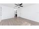 Bright bedroom with ceiling fan and wood-look floors at 1236 Fleetwood Nw Dr, Port Charlotte, FL 33948