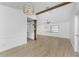 Dining area with hardwood floors and modern light fixture at 1236 Fleetwood Nw Dr, Port Charlotte, FL 33948
