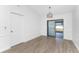 Simple dining room with sliding doors and hardwood floors at 1236 Fleetwood Nw Dr, Port Charlotte, FL 33948