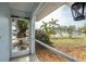 Screened porch with view of tropical landscaping at 1236 Fleetwood Nw Dr, Port Charlotte, FL 33948