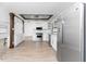 Modern kitchen with stainless steel appliances and wood beams at 1236 Fleetwood Nw Dr, Port Charlotte, FL 33948