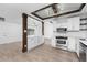 Modern kitchen with white cabinets, stainless steel appliances, and quartz countertops at 1236 Fleetwood Nw Dr, Port Charlotte, FL 33948