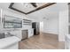 Modern white kitchen with stainless steel appliances and open shelving at 1236 Fleetwood Nw Dr, Port Charlotte, FL 33948