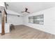 Bright living room featuring hardwood floors and a ceiling fan at 1236 Fleetwood Nw Dr, Port Charlotte, FL 33948