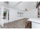 Bright living room features wood-look floors and a view to the backyard at 1236 Fleetwood Nw Dr, Port Charlotte, FL 33948
