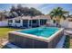 Relaxing backyard pool and patio with screened enclosure at 1236 Fleetwood Nw Dr, Port Charlotte, FL 33948