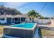 Clean lines and a bright blue pool make this backyard oasis inviting at 1236 Fleetwood Nw Dr, Port Charlotte, FL 33948