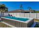 Modern, rectangular pool in a sunny backyard setting at 1236 Fleetwood Nw Dr, Port Charlotte, FL 33948