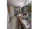 Large bathroom with granite double vanity at 1281 Nebraska Ln, North Port, FL 34286