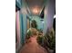 Covered patio with tile flooring and lush tropical plants at 1281 Nebraska Ln, North Port, FL 34286