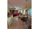 Bright dining area with tile flooring and views to the kitchen and living room at 1281 Nebraska Ln, North Port, FL 34286