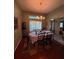 Formal dining room with hardwood floors and a chandelier at 1281 Nebraska Ln, North Port, FL 34286