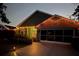 Attractive home exterior with festive holiday lighting and landscaping at 1281 Nebraska Ln, North Port, FL 34286